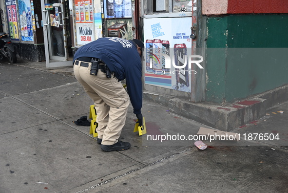 New York City Police Department crime scene investigators are at the scene of a 34-year-old man being stabbed multiple times to death at Muc...