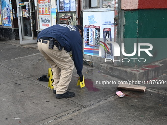 New York City Police Department crime scene investigators are at the scene of a 34-year-old man being stabbed multiple times to death at Muc...