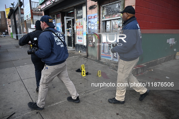 New York City Police Department crime scene investigators are at the scene of a 34-year-old man being stabbed multiple times to death at Muc...