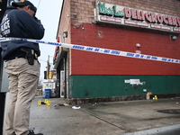 New York City Police Department crime scene investigators are at the scene of a 34-year-old man being stabbed multiple times to death at Muc...