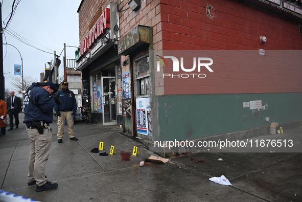 New York City Police Department crime scene investigators are at the scene of a 34-year-old man being stabbed multiple times to death at Muc...