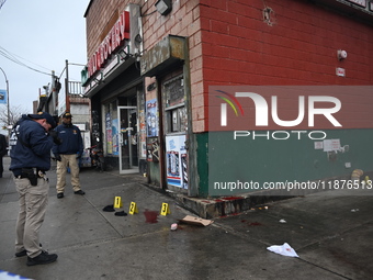 New York City Police Department crime scene investigators are at the scene of a 34-year-old man being stabbed multiple times to death at Muc...