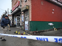 New York City Police Department crime scene investigators are at the scene of a 34-year-old man being stabbed multiple times to death at Muc...