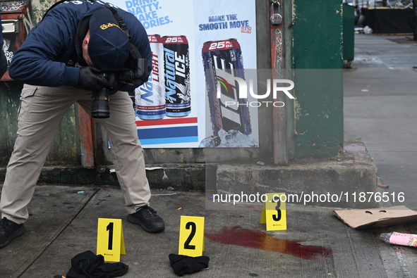 New York City Police Department crime scene investigators are at the scene of a 34-year-old man being stabbed multiple times to death at Muc...