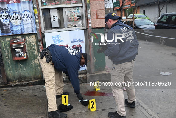 New York City Police Department crime scene investigators are at the scene of a 34-year-old man being stabbed multiple times to death at Muc...