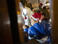 A Christmas retro tram with Santa Claus and Snow White is in Sofia, Bulgaria, on December 17, 2024. The retro tram, which is 115 years old,...