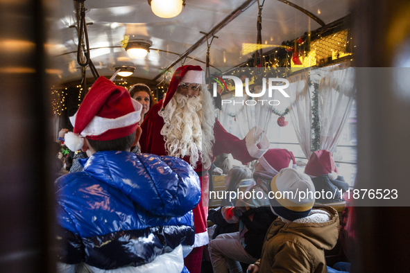 A Christmas retro tram with Santa Claus and Snow White is in Sofia, Bulgaria, on December 17, 2024. The retro tram, which is 115 years old,...