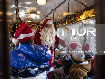 A Christmas retro tram with Santa Claus and Snow White is in Sofia, Bulgaria, on December 17, 2024. The retro tram, which is 115 years old,...