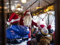 A Christmas retro tram with Santa Claus and Snow White is in Sofia, Bulgaria, on December 17, 2024. The retro tram, which is 115 years old,...