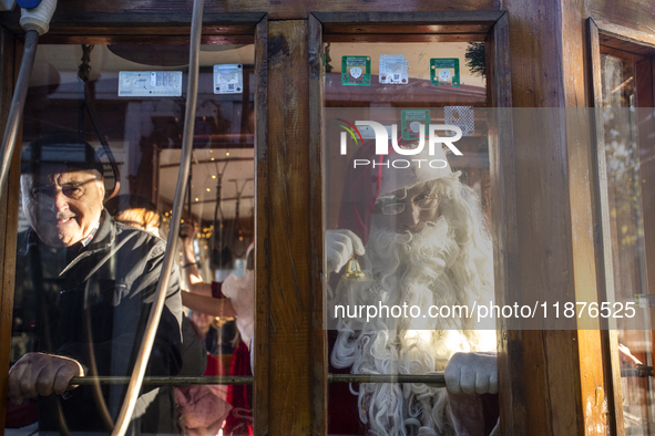 A Christmas retro tram with Santa Claus and Snow White is in Sofia, Bulgaria, on December 17, 2024. The retro tram, which is 115 years old,...