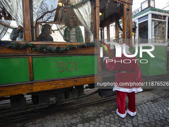 A Christmas retro tram with Santa Claus and Snow White is in Sofia, Bulgaria, on December 17, 2024. The retro tram, which is 115 years old,...