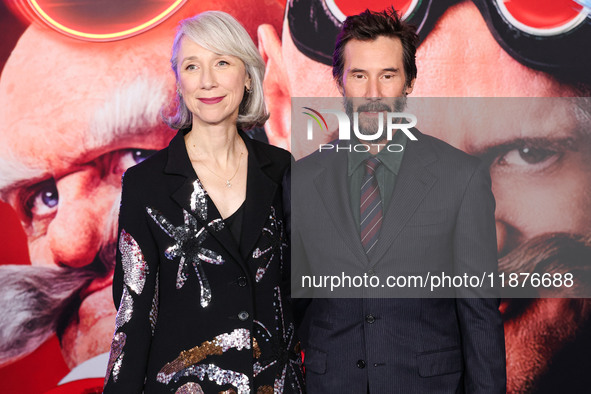 Alexandra Grant and boyfriend Keanu Reeves arrive at the Los Angeles Premiere Of Paramount Pictures' 'Sonic The Hedgehog 3' held at the TCL...