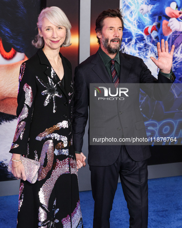 Alexandra Grant and boyfriend Keanu Reeves arrive at the Los Angeles Premiere Of Paramount Pictures' 'Sonic The Hedgehog 3' held at the TCL...