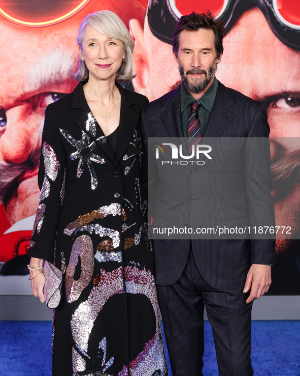 Alexandra Grant and boyfriend Keanu Reeves arrive at the Los Angeles Premiere Of Paramount Pictures' 'Sonic The Hedgehog 3' held at the TCL...