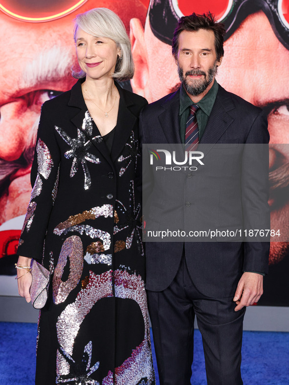 Alexandra Grant and boyfriend Keanu Reeves arrive at the Los Angeles Premiere Of Paramount Pictures' 'Sonic The Hedgehog 3' held at the TCL...