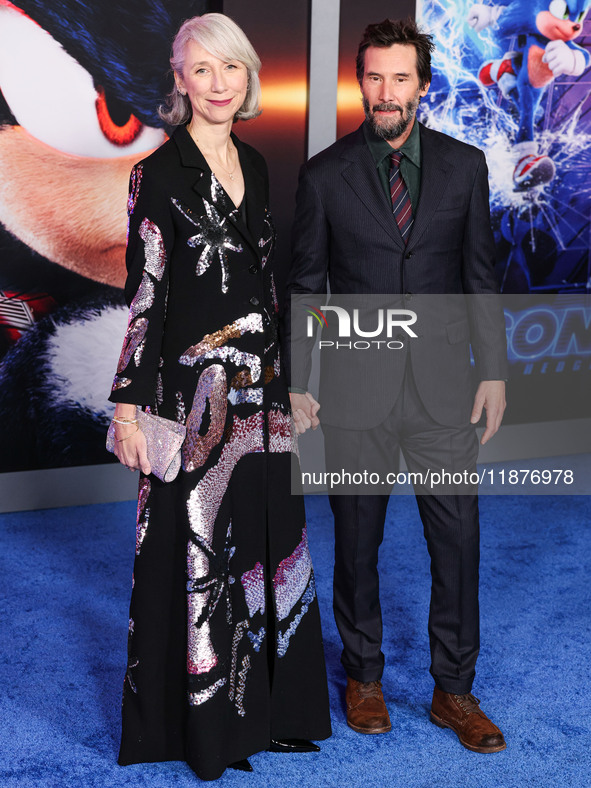 Alexandra Grant and boyfriend Keanu Reeves arrive at the Los Angeles Premiere Of Paramount Pictures' 'Sonic The Hedgehog 3' held at the TCL...