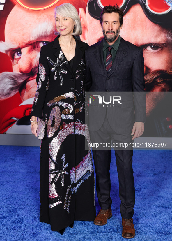 Alexandra Grant and boyfriend Keanu Reeves arrive at the Los Angeles Premiere Of Paramount Pictures' 'Sonic The Hedgehog 3' held at the TCL...