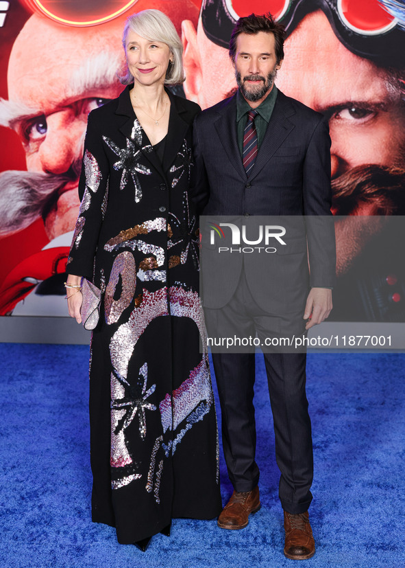 Alexandra Grant and boyfriend Keanu Reeves arrive at the Los Angeles Premiere Of Paramount Pictures' 'Sonic The Hedgehog 3' held at the TCL...