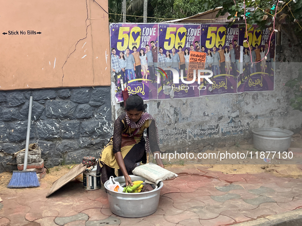 A woman sets up to sell fruit in Thiruvananthapuram, Kerala, India, on April 15, 2024. 