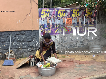 A woman sets up to sell fruit in Thiruvananthapuram, Kerala, India, on April 15, 2024. (