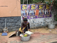 A woman sets up to sell fruit in Thiruvananthapuram, Kerala, India, on April 15, 2024. (