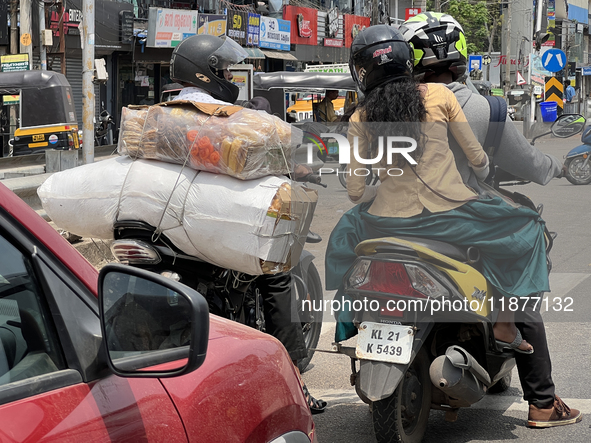 Traffic occurs in Thiruvananthapuram, Kerala, India, on April 15, 2024. 