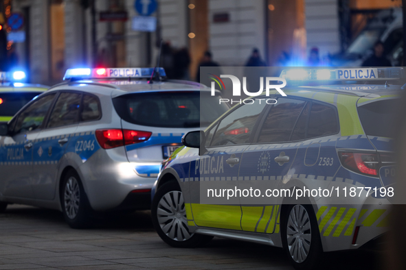 A police car with lights on is on the street in Warsaw, Poland, on December 12, 2024. 