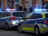 A police car with lights on is on the street in Warsaw, Poland, on December 12, 2024. (