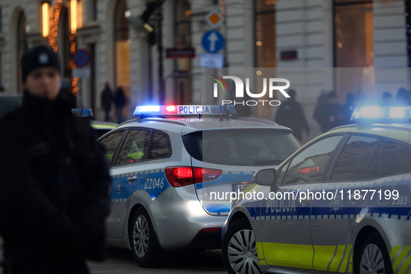 A police car with lights on is on the street in Warsaw, Poland, on December 12, 2024. 