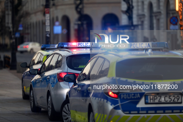 A police car with lights on is on the street in Warsaw, Poland, on December 12, 2024. 