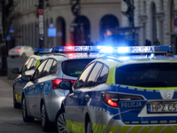 A police car with lights on is on the street in Warsaw, Poland, on December 12, 2024. (