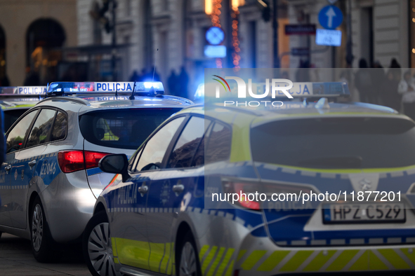 A police car with lights on is on the street in Warsaw, Poland, on December 12, 2024. 