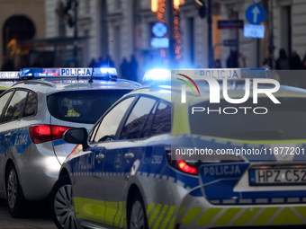 A police car with lights on is on the street in Warsaw, Poland, on December 12, 2024. (