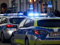 A police car with lights on is on the street in Warsaw, Poland, on December 12, 2024. (