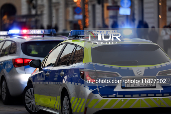 A police car with lights on is on the street in Warsaw, Poland, on December 12, 2024. 