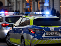 A police car with lights on is on the street in Warsaw, Poland, on December 12, 2024. (