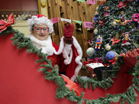 Mrs. Claus is aboard a sleigh inside the Mexican Postal Service at the Postal Palace in the Zocalo of Mexico City, Mexico, on December 17, 2...