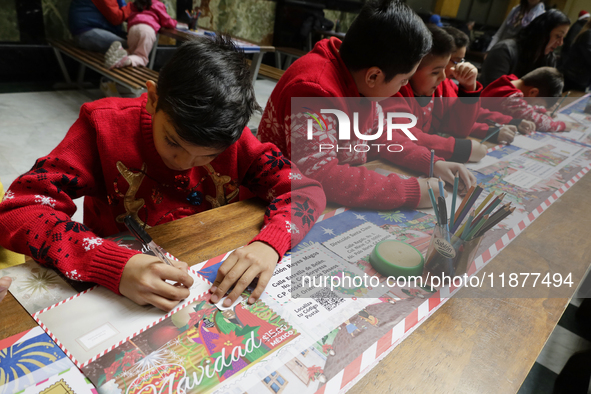 Girls and boys visit the Mexican Postal Service facilities at the Postal Palace in the Zocalo of Mexico City, Mexico, on December 17, 2024,...