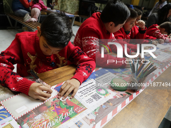 Girls and boys visit the Mexican Postal Service facilities at the Postal Palace in the Zocalo of Mexico City, Mexico, on December 17, 2024,...