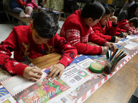 Girls and boys visit the Mexican Postal Service facilities at the Postal Palace in the Zocalo of Mexico City, Mexico, on December 17, 2024,...