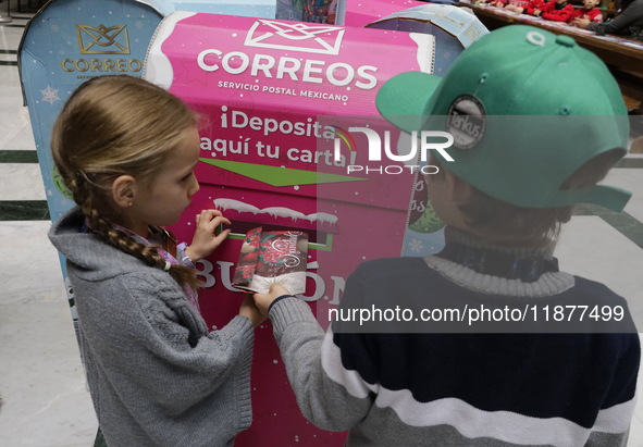 Girls and boys visit the Mexican Postal Service facilities at the Postal Palace in the Zocalo of Mexico City, Mexico, on December 17, 2024,...