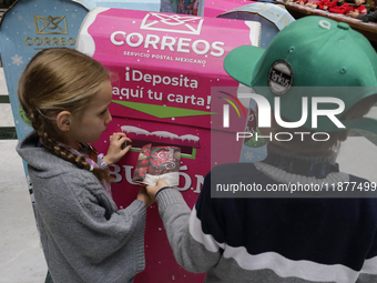 Girls and boys visit the Mexican Postal Service facilities at the Postal Palace in the Zocalo of Mexico City, Mexico, on December 17, 2024,...