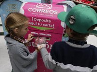 Girls and boys visit the Mexican Postal Service facilities at the Postal Palace in the Zocalo of Mexico City, Mexico, on December 17, 2024,...