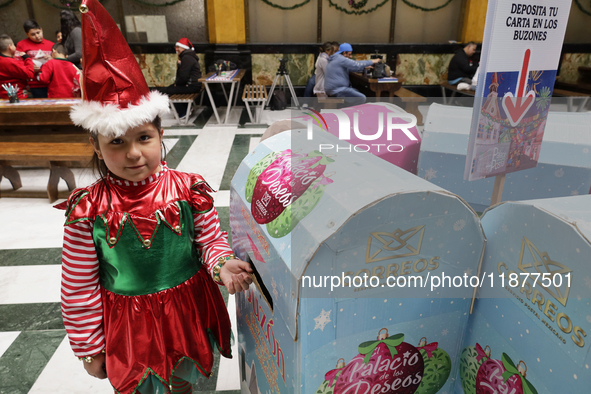 Girls and boys visit the Mexican Postal Service facilities at the Postal Palace in the Zocalo of Mexico City, Mexico, on December 17, 2024,...