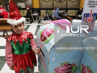 Girls and boys visit the Mexican Postal Service facilities at the Postal Palace in the Zocalo of Mexico City, Mexico, on December 17, 2024,...