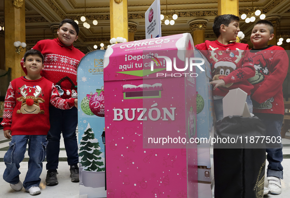 Girls and boys visit the Mexican Postal Service facilities at the Postal Palace in the Zocalo of Mexico City, Mexico, on December 17, 2024,...