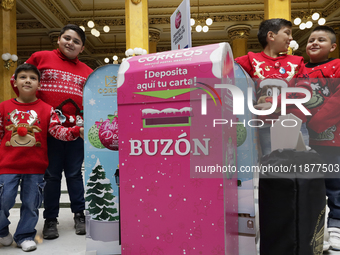 Girls and boys visit the Mexican Postal Service facilities at the Postal Palace in the Zocalo of Mexico City, Mexico, on December 17, 2024,...