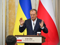 In Lviv, Ukraine, on December 17, 2024, Polish Prime Minister Donald Tusk speaks during a joint press conference with President of Ukraine V...