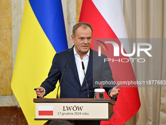 In Lviv, Ukraine, on December 17, 2024, Polish Prime Minister Donald Tusk speaks during a joint press conference with President of Ukraine V...