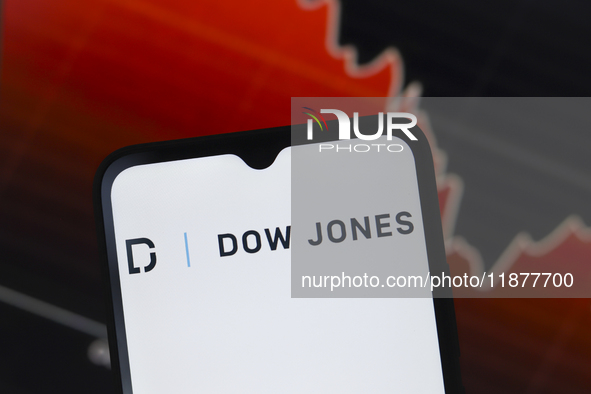 The Dow Jones Industrial Average logo appears on a smartphone screen in this illustration photo in Reno, United States, on December 17, 2024...